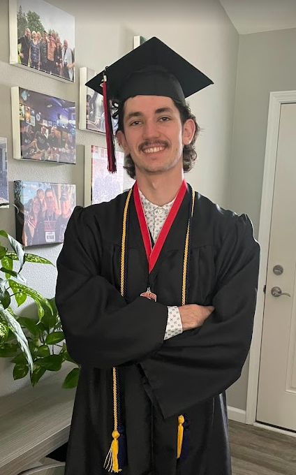 Donald Voetberg in SPASH graduation cap and gown with honors cords and medal